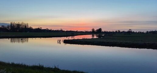 Fototapeta premium sunset over the river