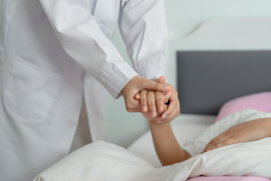 Close up of professional holding patient hand.  Empathy, mental health, support and consolation