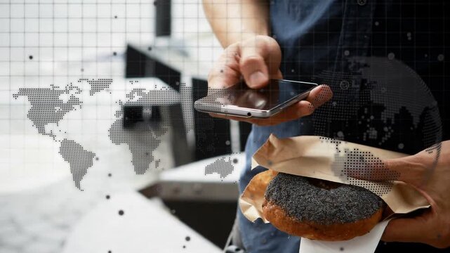 Man peeling bagel then pulling smartphone, tapping for directions under dotted tech map overlay