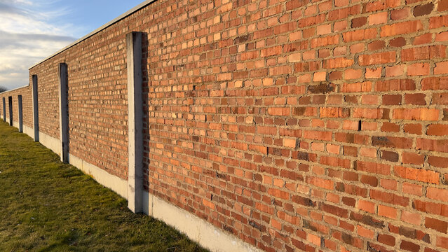 Prison or Camp Style Brick Wall in Germany in Golden Hour Light