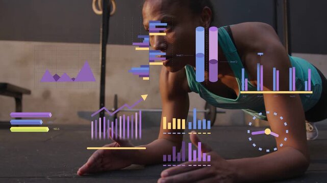 Woman holding forearm plank on gym floor, animated charts fading in and tracking fitness metrics