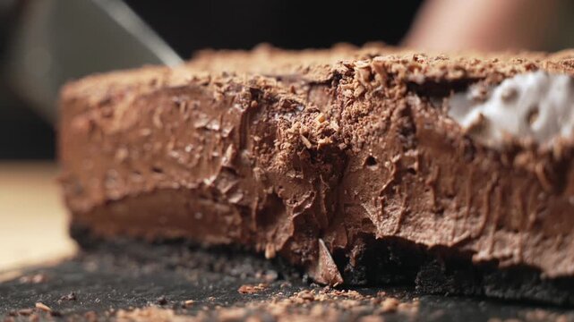 Close up of delicious fresh slice of Mousse brownie, Slow Motion shot. High quality 4k footage Culinary Dessert.