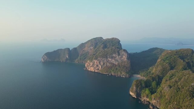 Koh Muk, Thailand: Aerial orbit drone footage of the dramatic coastline in the famous Koh Muk, or Mook island in the Andaman sea in Trang province in southern Thailand. 