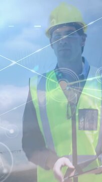 Tablet tapping initiating engineer scanning horizon and shifting right while HUD mapping site data