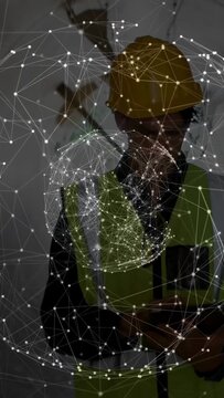 Vertical video: Site inspector tapping device and viewing rotating network hologram for inspection