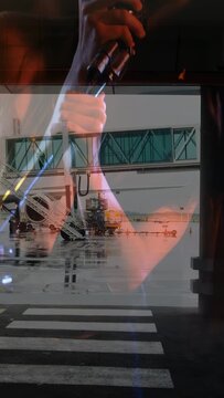 Vertical video: Singer appearing as reflection over gate window raising mic singing evoking travel