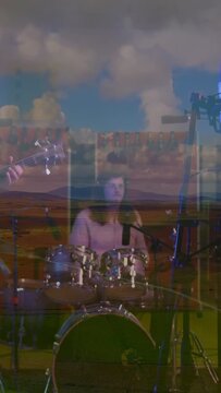Vertical video: Drummer glancing at guitar, starting beat for recording, field overlay expanding