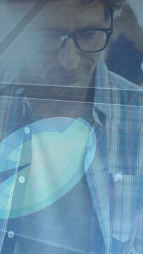 Vertical video: Camera pulling up revealing developer typing and reading code for app testing