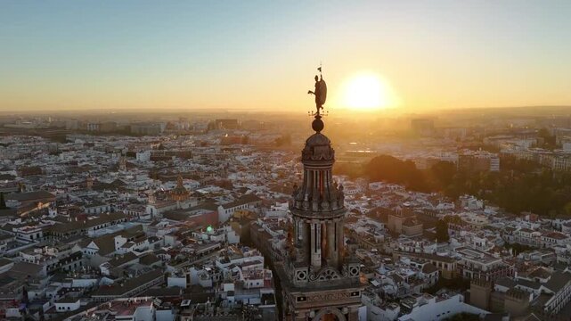 Giraldillo Statue on La Giralda Tower at Sunrise in Seville, Spain