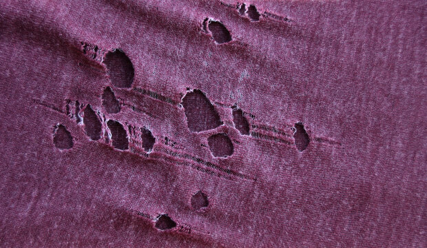 teared rag spread isolated on white background backdrop pattern texture. hole in tissue black fabric torn stitch hole loose threads Torn fabric with frayed edges Mockup mock up mock-up template blank