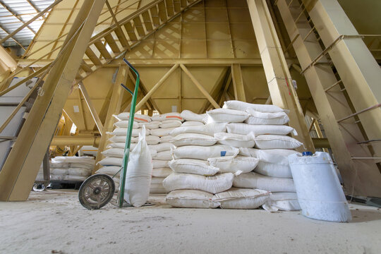 Animal feed ingredients bags stacking in farm.