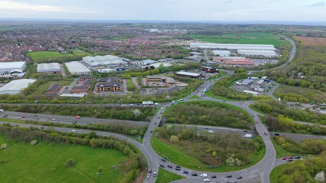 Top down aerial view of heavy traffic at Flagstaff Island roundabout near Ashby-de-la-Zouch UK