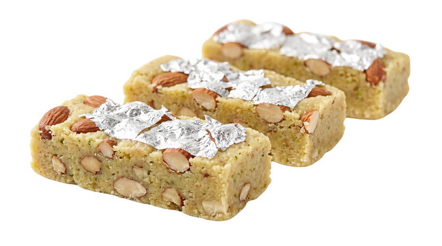 Traditional Indian almond barfi with silver leaf, sweet badam burfi pieces with nuts, festive Diwali dessert snacks with vark isolated PNG with Transparent Background