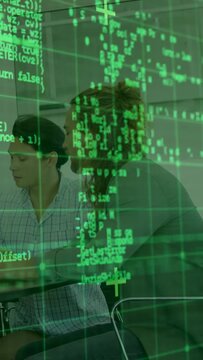 Vertical video: Screen update spawning green code overlay, woman leaning over desk, reviewing work