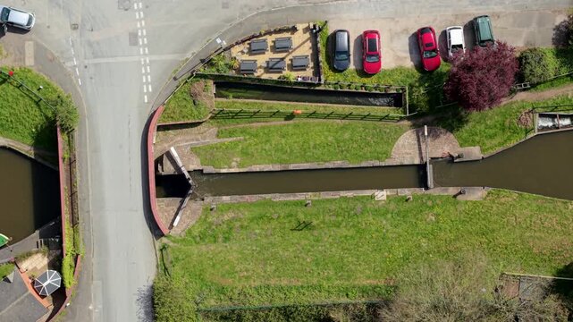 Top down aerial view of narrowboats on the Trent and Mersey Canal at Barton Marina UK