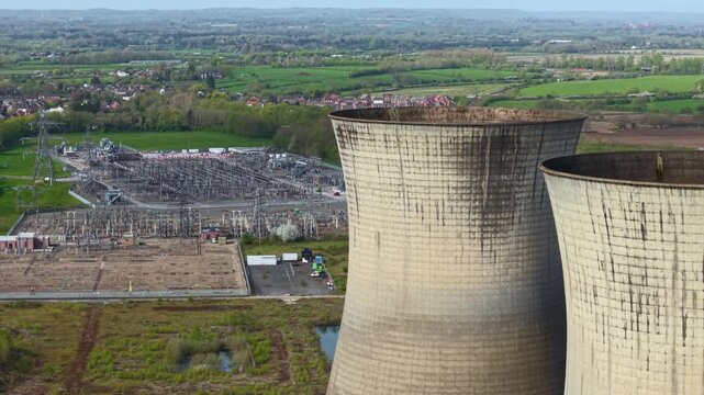 Aerial drone view of five derelict cooling towers at Willington Power Station Derbyshire UK