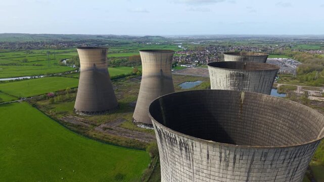 Aerial drone view of five derelict cooling towers at Willington Power Station Derbyshire UK