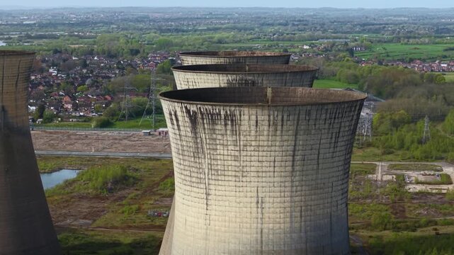 Aerial drone view of five derelict cooling towers at Willington Power Station Derbyshire UK
