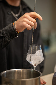 bartender hand using a bar spoon