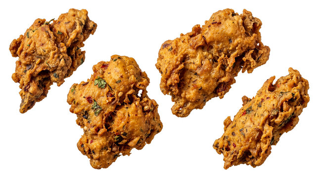 Crispy vegetable pakora fritters, golden brown Indian onion bhaji snacks, deep fried spicy vegetable appetizers with herbs and spices isolated PNG with Transparent Background