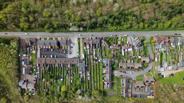 Top down aerial view of residential houses and forest in Albert Village UK
