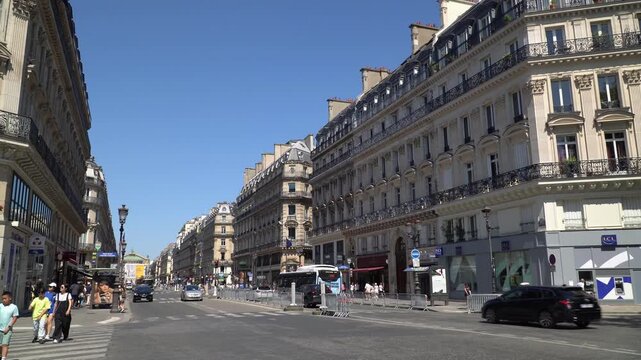 Iconic Parisian architecture and grand street lines along Avenue de l'Opera in central Paris, France.