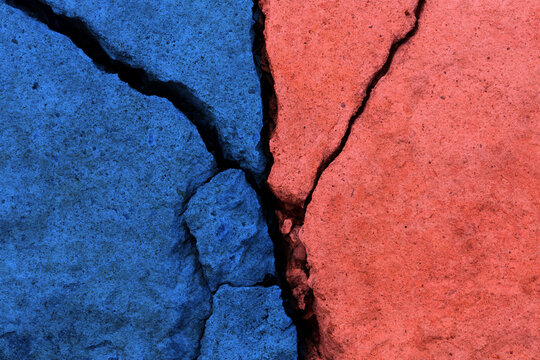 Cracked concrete surface in two colors, Conflict and divisio