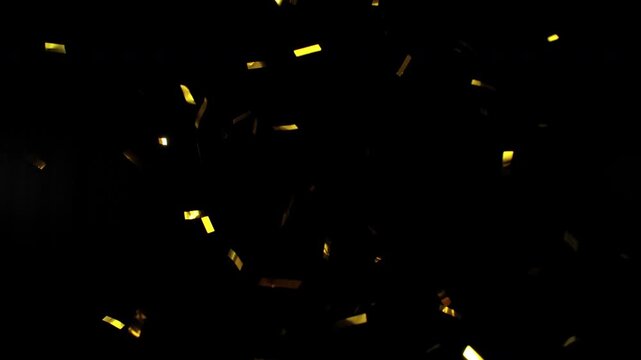 Super slow motion of flying confetti isolated on black background. Filmed on high speed cinema camera