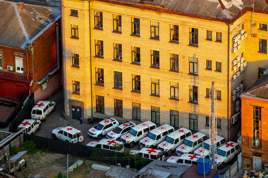 ICRC humanitarian aid vehicles parked by a building, symbolizing relief efforts in Dnipro, Ukraine