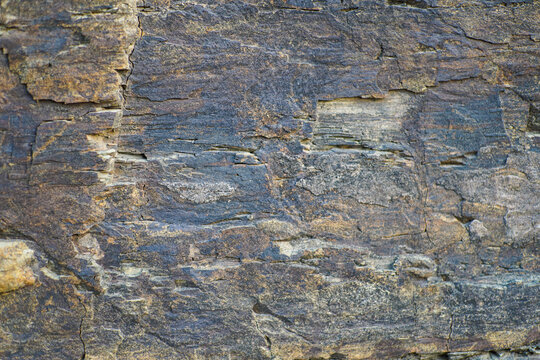 Abstract Detailed View of Natural Layered Rock Texture with Cracks and Rough Surface