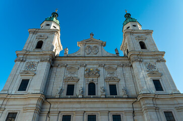 Obraz premium Salzburg Cathedral facade with twin towers under clear blue sky - Austria