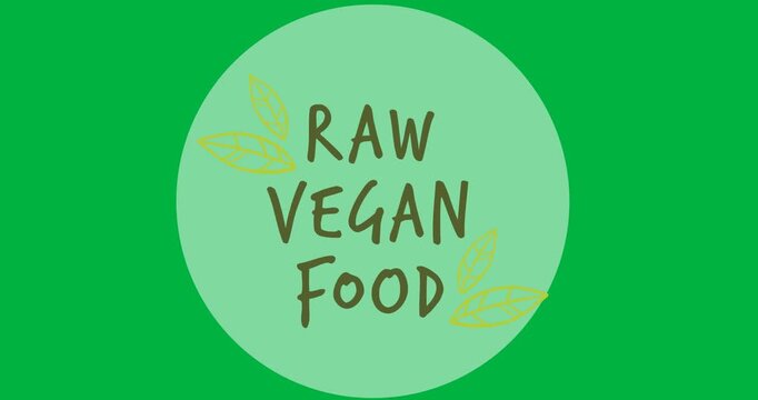 Raw vegan food text with leaves icon over a grey round banner on black background