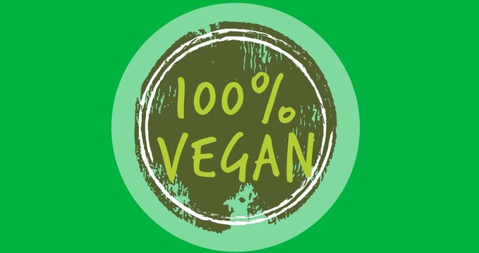 Digital animation of 100 percent vegan text over a grey round banner on black background