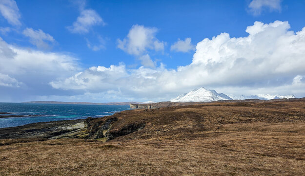 View from Elgol towards The Cuillins with fresh snow on the mountains from Storm Dave. Isle of Skye, Scotland