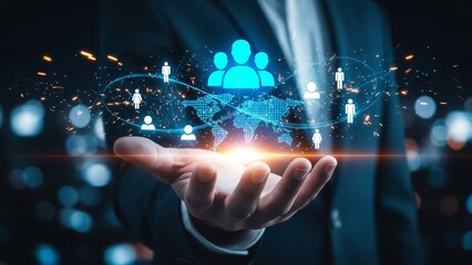 Fototapeta premium Hand holds a glowing global network of interconnected people icons, symbolizing worldwide human resources and community.