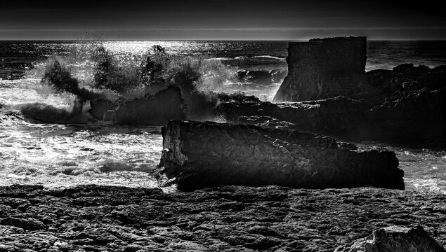 Powerful Ocean Waves Crashing on Rocky Coast Black and White
