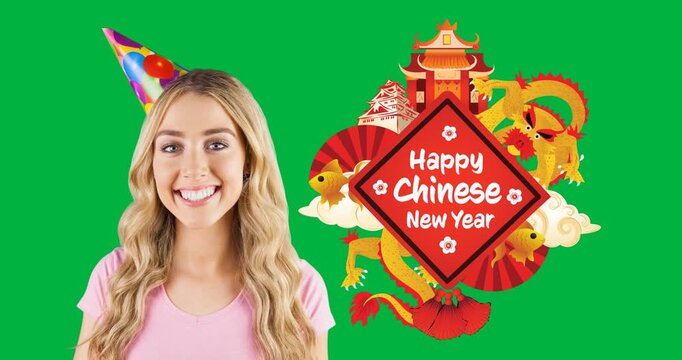 Portrait of caucasian woman wearing a party hat smiling and happy chinese new year text banner