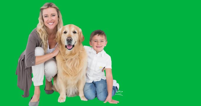 Portrait of caucasian mother and son with a dog smiling against black background