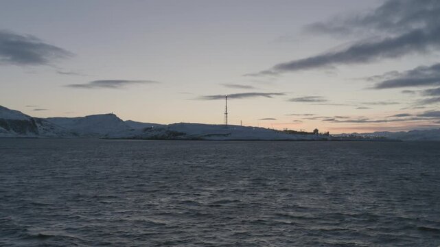 Sailing passed Melk&oslash;ya gasskraftverk on the way to Hammerfest in Winter