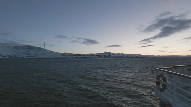 Sailing passed Melk&oslash;ya gasskraftverk on the way to Hammerfest in Winter