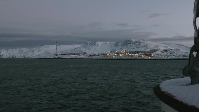 Sailing passed Melk&oslash;ya gasskraftverk on the way to Hammerfest in Winter