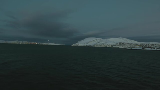 Sailing passed Melk&oslash;ya gasskraftverk on the way to Hammerfest in Winter