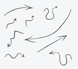 Obraz premium A collection of nine black hand-drawn, sketched charcoal textured arrows, featuring unique wavy, curved, zigzag, and looping shapes on a plain background for creative design direction.