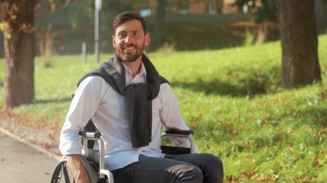 Bright outdoor scene with inspiring man, Uplifting image of man in wheelchair outdoors smiling confidently