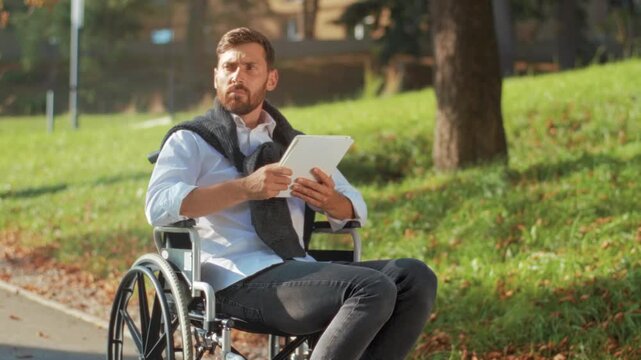 Autumn park with accessible technology, Individual using modern device in park symbolizes independence and focus