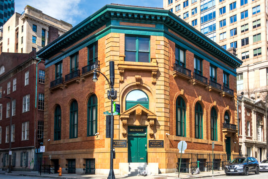 Baltimore, MD - US - Mar 22, 2026 This historic brick building, with a teal-painted cornice located at Commerce and Water Streets in Baltimore, is the headquarters of Maury, Donnelly and Parr.