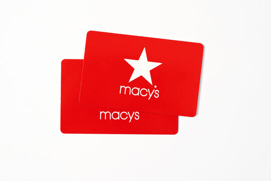 Novi, Michigan, US - 6 Apr 2026 : Two red Macys gift cards with the iconic white star logo isolated on white background