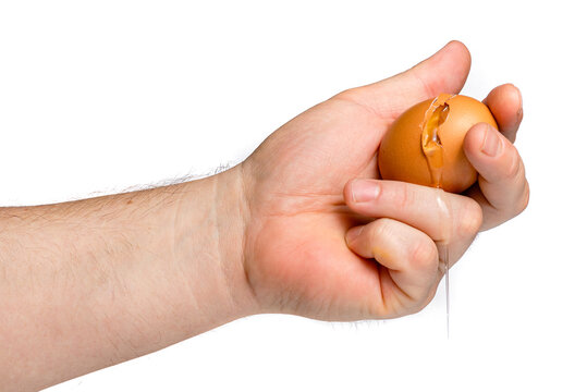 Crushing Raw Egg in Fist Concept