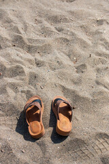Fototapeta premium flip flops on the beach