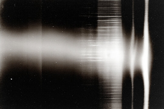 retro film overlay effect with scratch dust and bokeh light leaks,retro grain noisy film distressed light leak flare on black background,black and white abstract background,Abstract old film texture